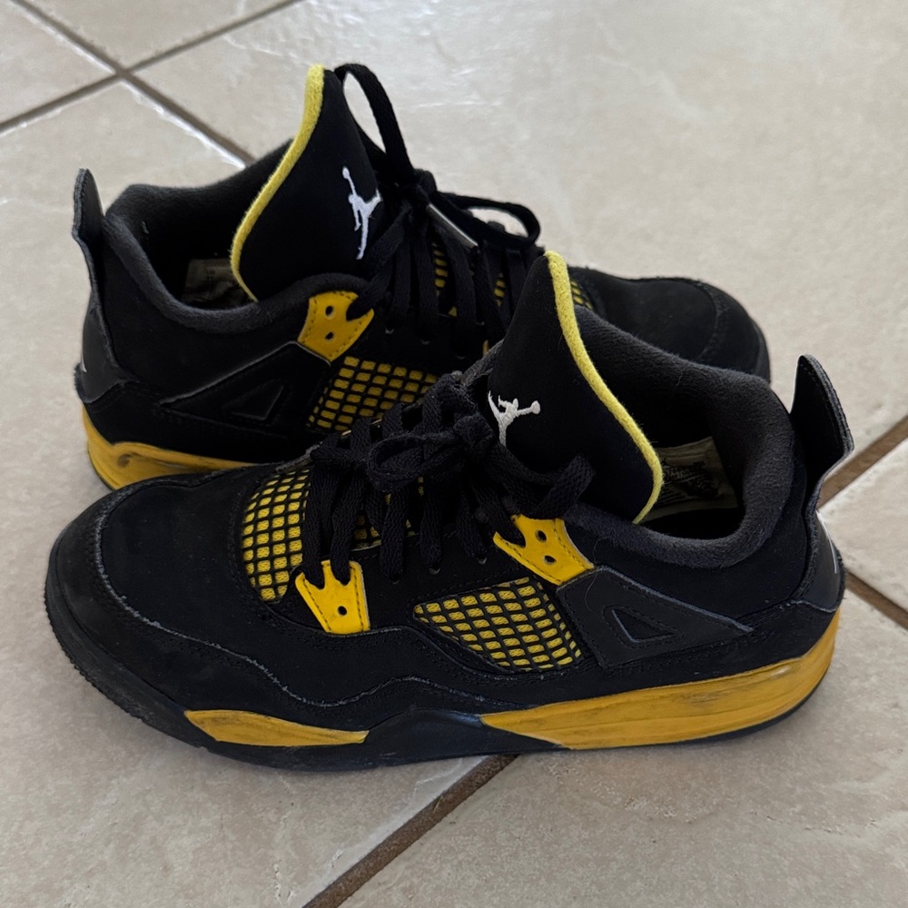 Jordan 4’s Thunder Kids Black and Yellow Sneakers